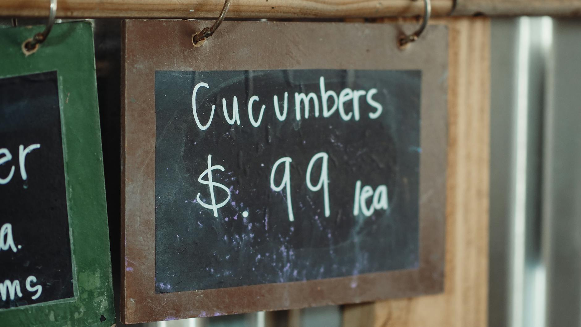 Industrial Relocations 2025: Affordable and Effortless Secrets Close-up of a chalkboard sign showing cucumbers priced at 99 cents each.