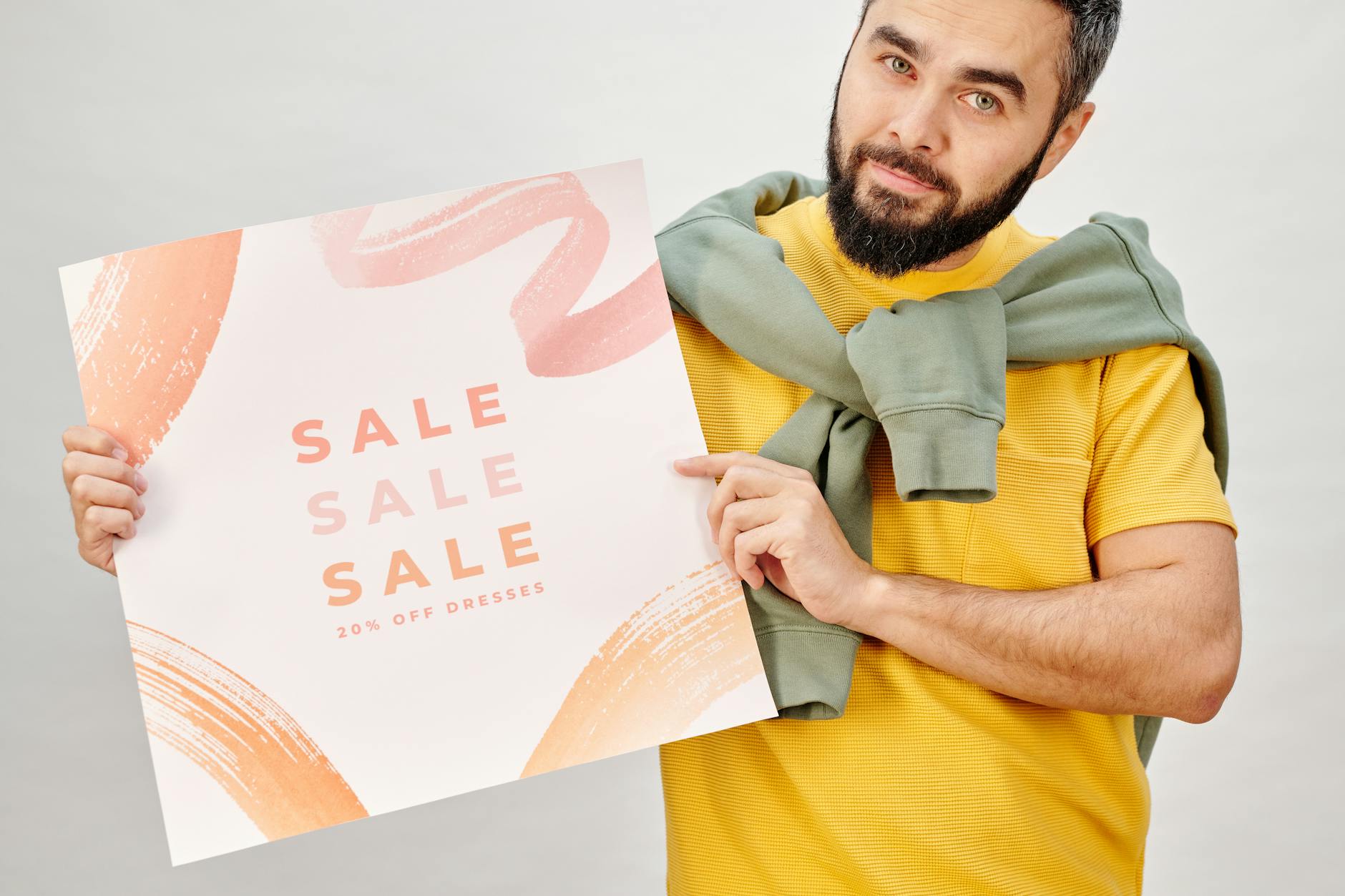Affordable Commercial Waste Removal: 4 Must-Know Secrets Man holding a sale poster advertising 20% off dresses. Perfect for Black Friday promotions.