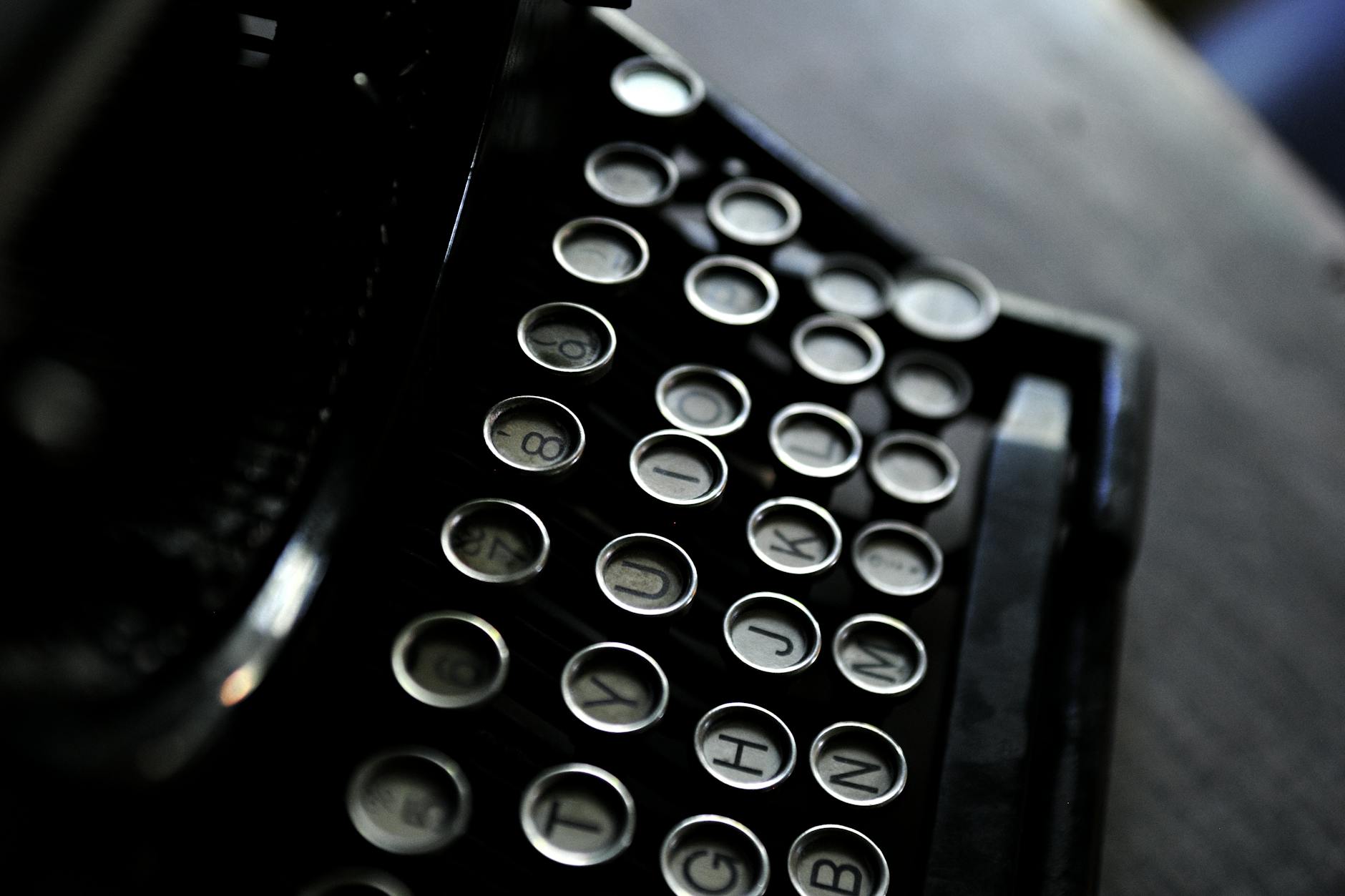 Industrial Removals: 5 Must-Avoid Common Mistakes Artistic shot of vintage typewriter keys with a classic black and white contrast.