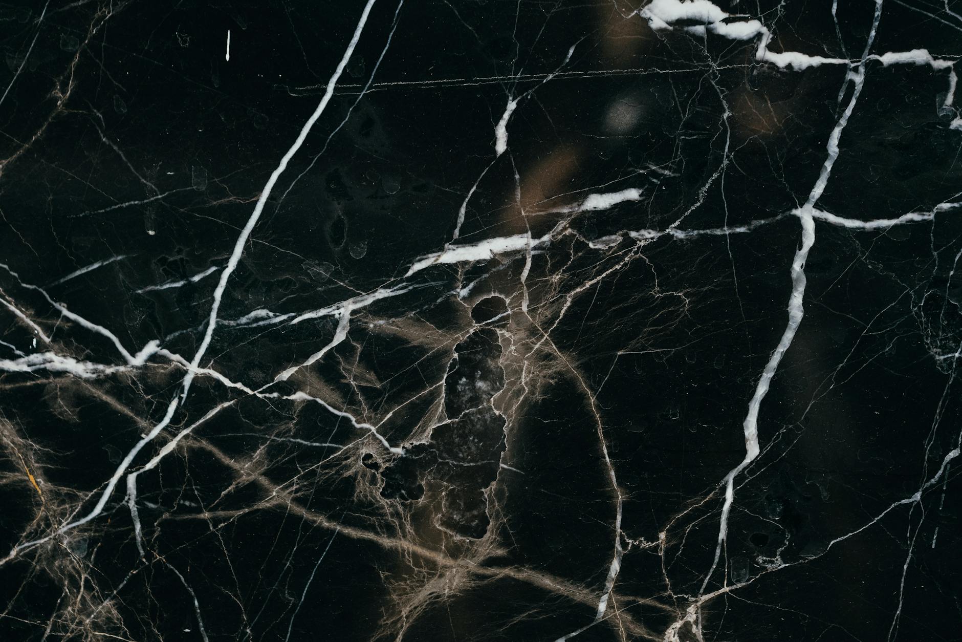 Office Relocation Strategies: Effortless Tips for Multi-Floor Moves Close-up view of a black marble texture, showcasing intricate white veining patterns.